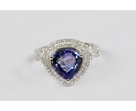 14K white gold and diamond ring set with a pear cut tanzanite approx. 4 carats, diamonds approx. 0.75 carat weight 