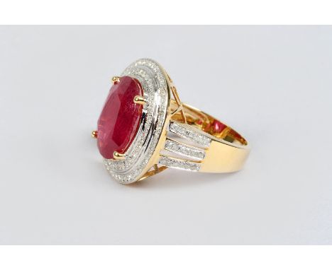 14K yellow gold and diamond ring set with an oval cut ruby approx. 7 carat, diamond approx. 1.25 carat weight 