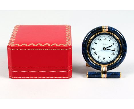 Cartier, Paris, travel clock, gilt brass and blue enamel case, circular dial with Roman numerals, quartz Swiss movement with 