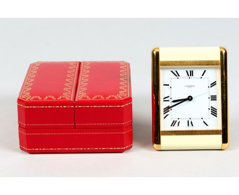 Cartier, Paris, travel clock, gilt brass and ivory enamel case, rectangular dial with Roman numerals, quartz Swiss movement w