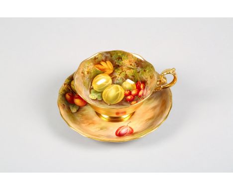 Royal Worcester tea cup and saucer, gilt exterior, with hand painted interior with fallen fruit signed Townsend date coded 19