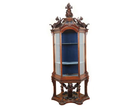 19th Century Italian walnut vitrine, carved putti figure finial flanked either side by carved winged mythical beasts over a s