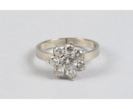 Ladies seven stone diamond cluster ring, daisy form, centre stone .33 carat surrounded by six .15 carat diamonds, brilliant c