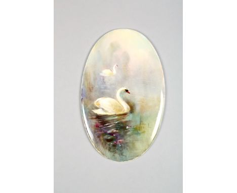 Royal Worcester ceramic plaque, oval shaped, hand painted swimming swans, signed James Stinton date coded 1926 7cm x 11cm 