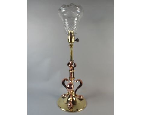 An Arts and Crafts Brass and Copper Table Lamp with Glass Shade. 