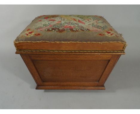 A 19th Century Oak Sarcophagus Shaped Box Footstool with Upholstered Hinged Lid having Tapestry of Bird. 60x53x49cm High