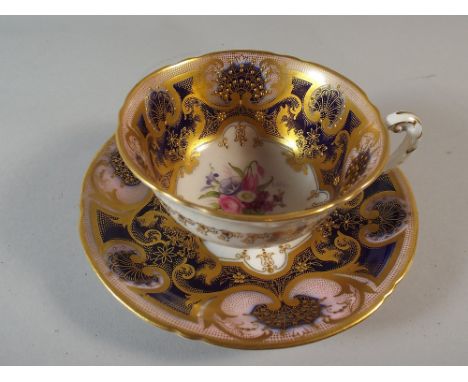 A Royal Worcester Cabinet Cup and Saucer Decorated in Gilt and Cobalt Blue with Hand Painted Floral Decoration By E.Phillips.