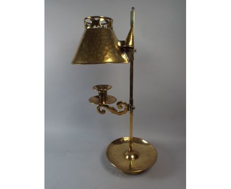 An Arts and Crafts Brass Candlestick with Adjustable Holder and Adjustable Shade. Hand Beaten Circular Drip Tray, Conical Snu