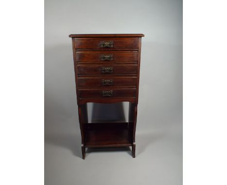 An Edwardian Five Drawer Music Cabinet with Stretcher Shelf.