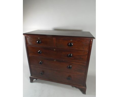 A Good Quality Victorian Mahogany Bedroom Chest of Two Short and Three Long Drawers all with Turned Ebonised Handles on Brack