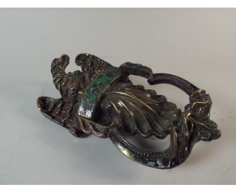 A George III Brass Door Knocker Modelled as an Eagle Over a Shell and The Handle as Two Stylised Dolphins. 19x10cm