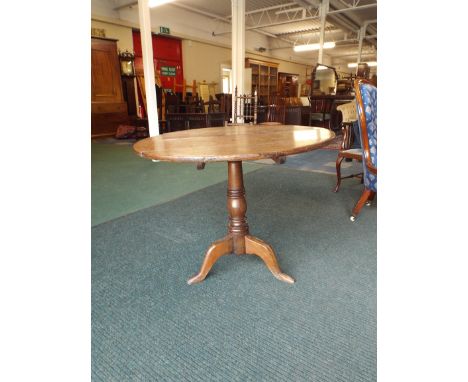 A 19th Century Oak Snap Top Tripod Table. 83cm Diameter