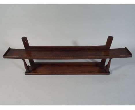 A 19th Century Patinated Beech Wood Wall Hanging Shelf with Turned Supports. 86cm Wide. 