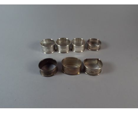 A Collection of Seven Various Silver Napkin Rings with Engine Turned Decoration