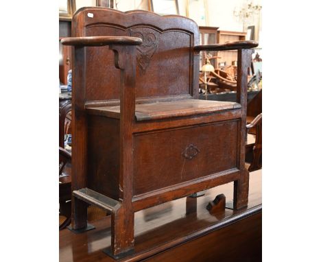 A small oak box seated hall seat with umbrella/stick stands to each side, 82 cm x 36 cm x 82 cm