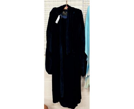 A vintage Debenham Freebody dark blue velvet lady's evening coat with balloon sleeves and scarf tie to neck 