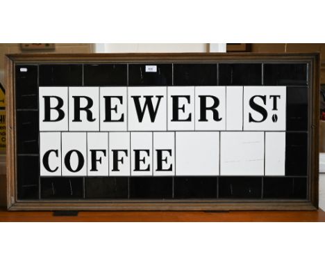 A framed tile panel - 'Brewer St Coffee' 54 x 109 cm overall 