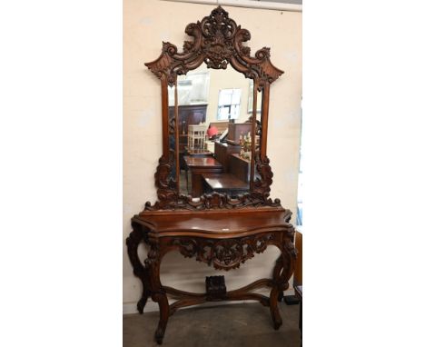 A Rococo style carved hardwood serpentine front console table and mirror, 138 x 50 x 234 cm h