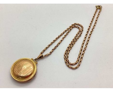 A Vintage "9ct Back &amp; Front" Circular Locket Pendant with Engine Turned Decoration, on a chain stamped "9c" (non gold lat