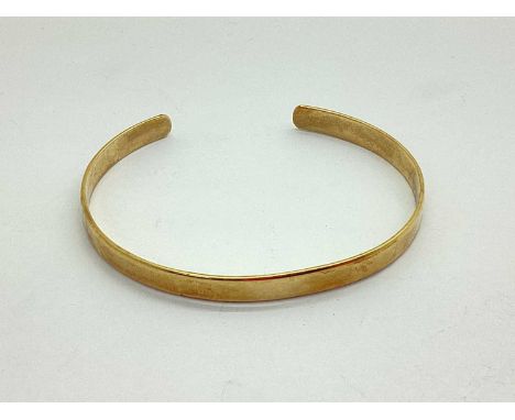 A 9ct Gold Bangle, of plain design (12.9grams).