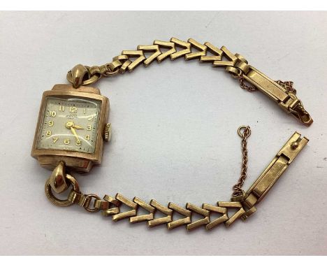 Enicar; A 9ct Gold Cased Ladies Wristwatch, of Art Deco design, the shaped case engraved "1992" on reverse, to 9ct gold chevr