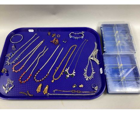 A Collection of Diamanté Set Jewellery, to include fringed necklaces, clip-on earrings, line set bracelet, cocktail ring etc 