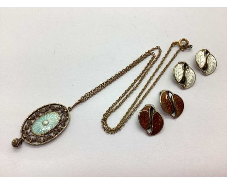 Marius Hammer; A Norwegian Enamel Pendant, oval filigree design, gilt with central panel highlighted in pale blue, stamped ma