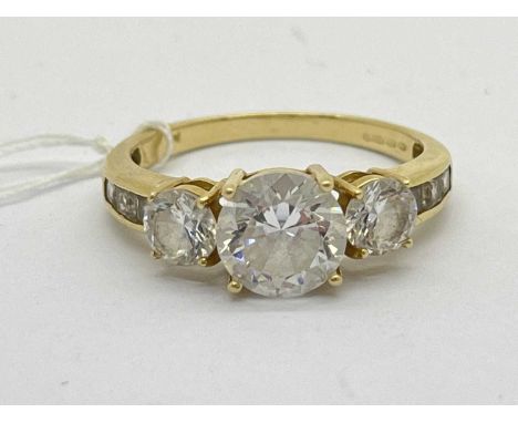 A 14ct Gold Three Stone Dress Ring, the graduated stones to tapered line set shoulders stamped "14K CZ" (finger size T) (4.1g