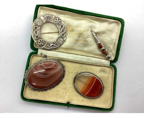 A Victorian Banded Agate Oval Panel Brooch, within shaped and engraved border, engraved to the reverse "In Affectionate Remem