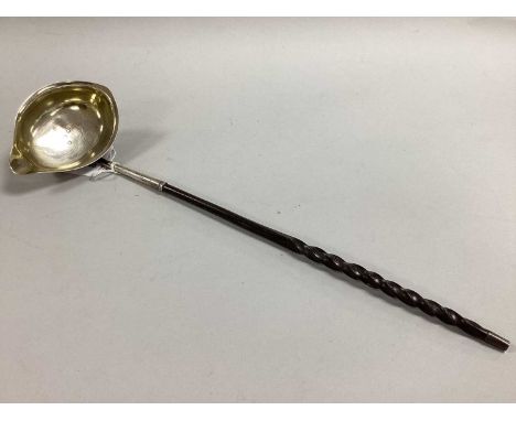 A Georgian Hallmarked Silver Toddy Ladle, JS, London 1807, the oval bowl with side lip (previously gilt lined), with twisted 