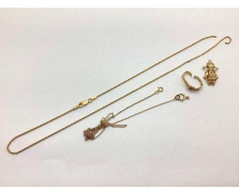 A Modern Chain, stamped "375" (broken); a ring (damages); novelty rag doll pendant, etc.8 grams in weight.