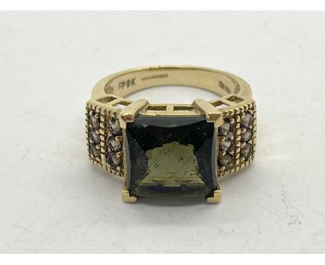 A 9ct Gold Stone Set Cocktail Ring, four claw set to stepped shoulders and tapered band (finger size L1/2) (5grams).