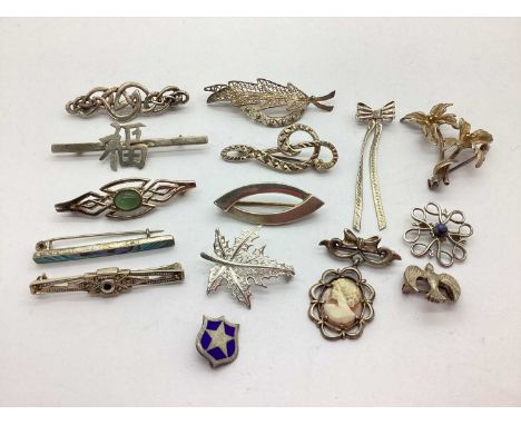 An Assortment of "925" and Other Brooches, to include filigree maple leaf, Celtic style cabochon set, treble clef, cameo drop