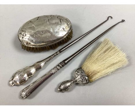 A Hallmarked Silver Backed Brush, (dents / bristle loss); a decorative crumb brush, the handle stamped "Sterling"; two hallma