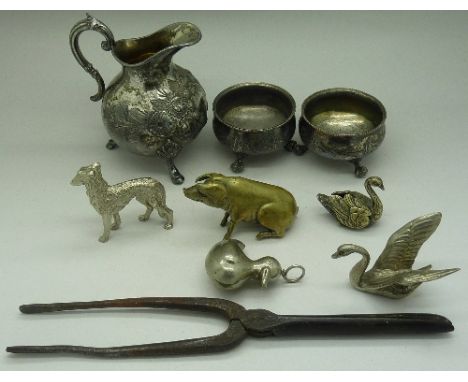 A brass model of a pig, a pair of EPNS salts, a rattle, etc.