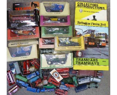 Corgi and Matchbox model vehicles, some playworn, and two albums of collectors cards, trains and trams