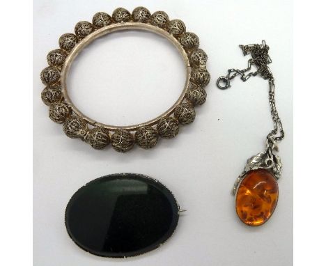 A white metal bangle, pendant and chain and stone set brooch