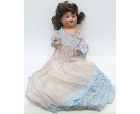 A German Burggrub bisque head doll with silk dress, 241-3½