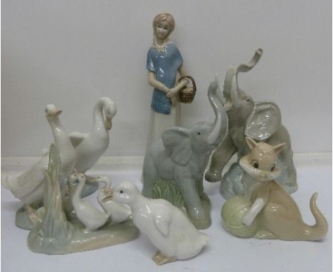 A Nao figure of an elephant, four Nao figures of geese, a Porceval figure of a kitten, a figure of a girl and one other figur