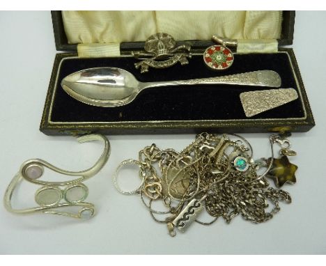 A silver spoon, silver jewellery, a metal bangle and a Death or Glory badge