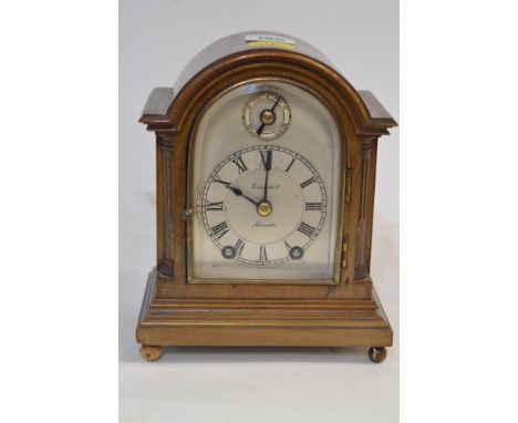 A small early 20th Century mahogany cased mantel clock by Goldsmiths Co, Newcastle, the Roman dial with subsidiary dial, move