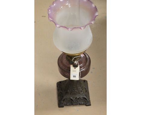 An Amethyst duplex oil lamp with matching shade, 56cms high.