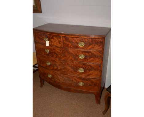 A 19th Century flame mahogany bowfront chest of two short and three long drawers, on outswept bracket feel, 105cms high.