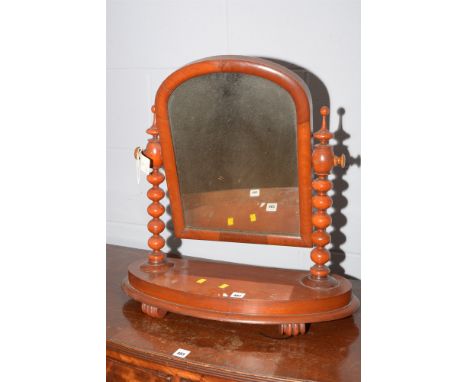A Victorian mahogany swing frame toilet mirror with bobbin turned supports.