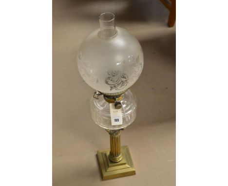 A Hinks's Duplex brass Corinthian column style oil lamp with glass reservoir and overlay glass shade, 68cms high.