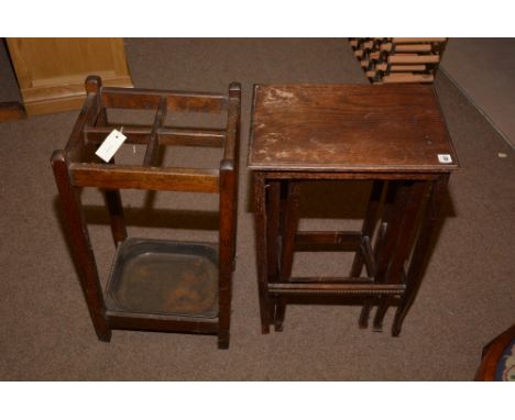 A late 19th Century oak stick stand; together with an oak nest of three tables.