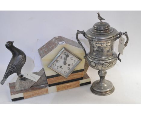 Art deco marble mantle clock with pigeon motif; together with a two-handled trophy 'Preesall Homing Society/1910'.