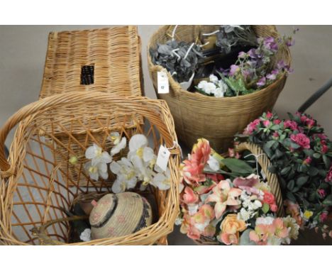 A wicker log basket; picnic basket; and hamper; together with a selection of artificial flowers.