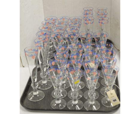 A large collection of hand painted matching glassware decorated with blue and pink leaf design, to include: twenty eight wine