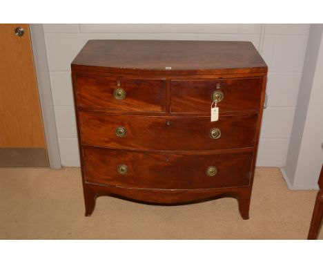 A Georgian mahogany bowfront chest of two short and two long drawers, raised on bracket feet, 90cms wide.